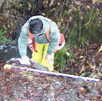 Field Technician Carol Rourke gathers data on migration barriers